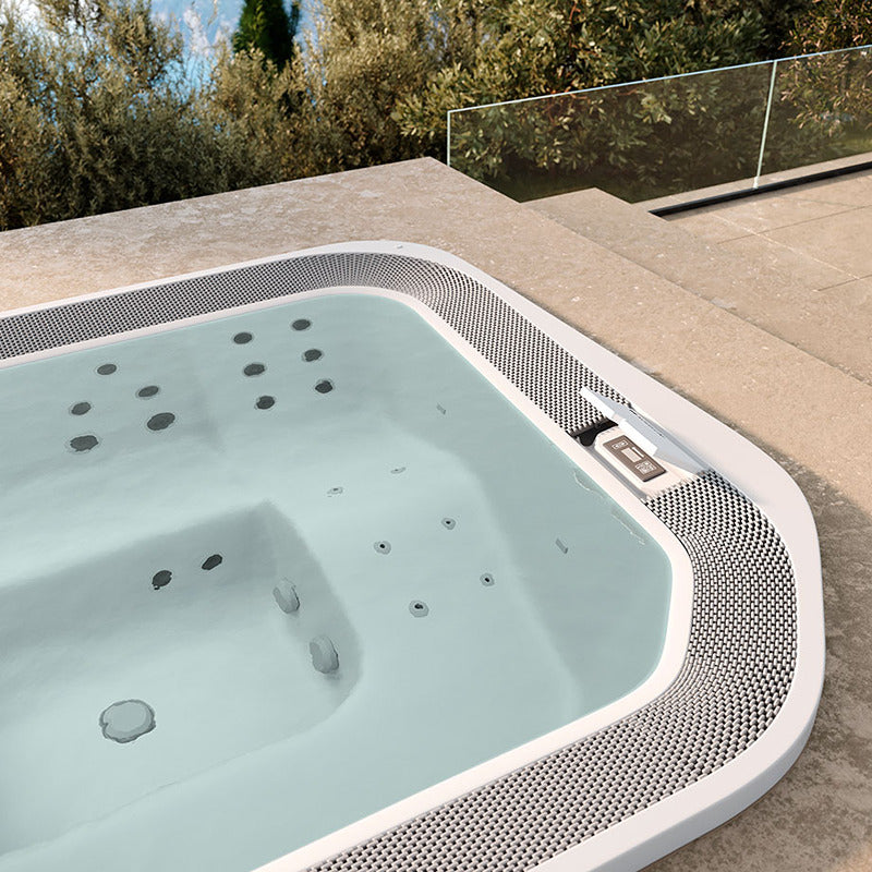Close-up of the Novellini Moon whirlpool with ergonomic seat shape, numerous massage jets and integrated control panel - design meets function.